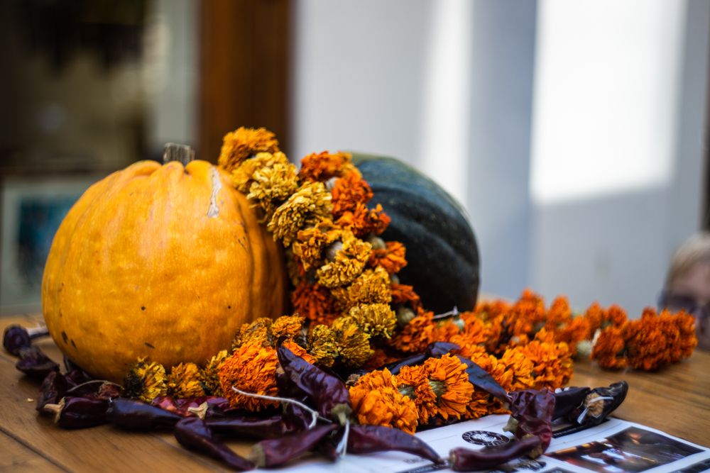Two square and flowers on fall table setting