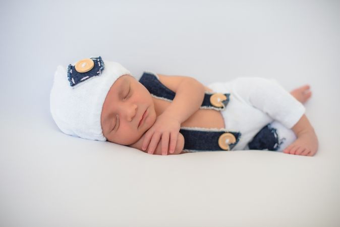 Cute infant sleeping on bed