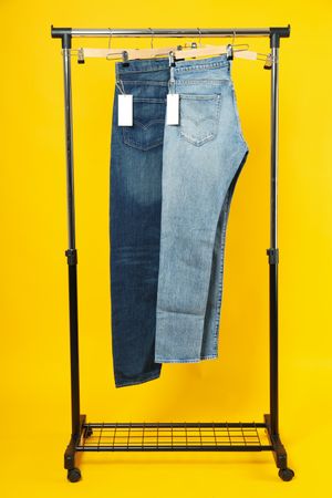 Jeans hang on hangers