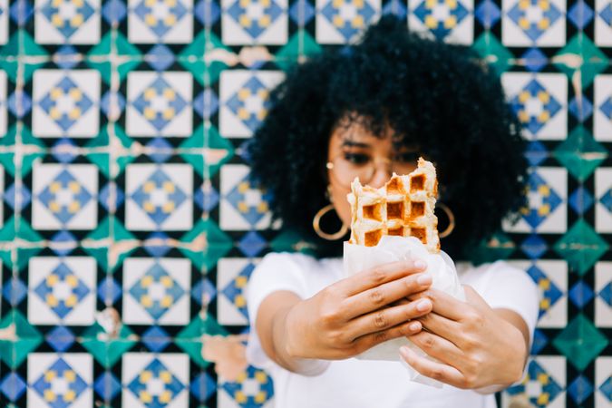 Cheerful female with tasty waffle