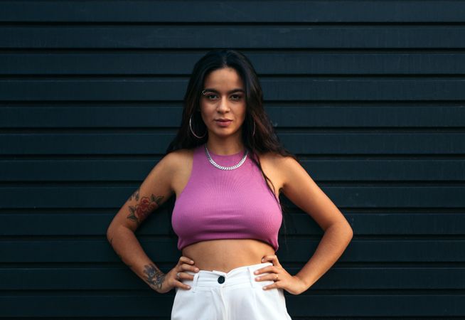 Portrait of a latina with tattoos and piercings outdoors