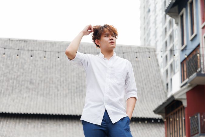 Asian man in casual style standing in the city