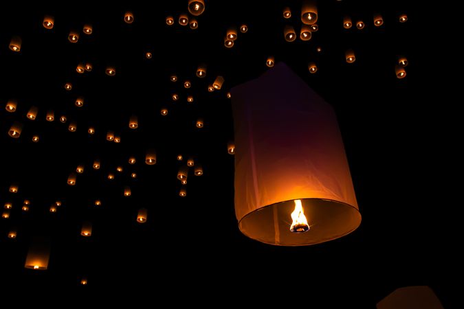 Lit sky lanterns at night