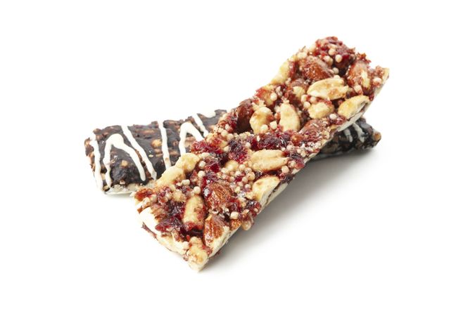Tasty granola bars isolated on blank background