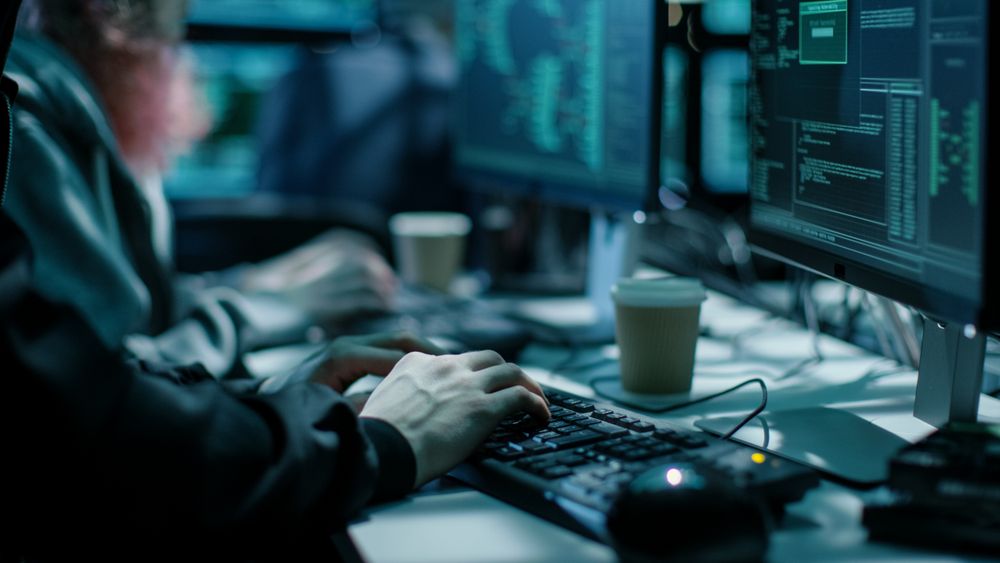 Close-up Shot of Hacker using Keyboard.