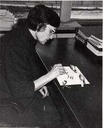 Washington D.C., USA - 1944:  Roxie Collie S. Laybourne identifying bird feathers bYzpG0