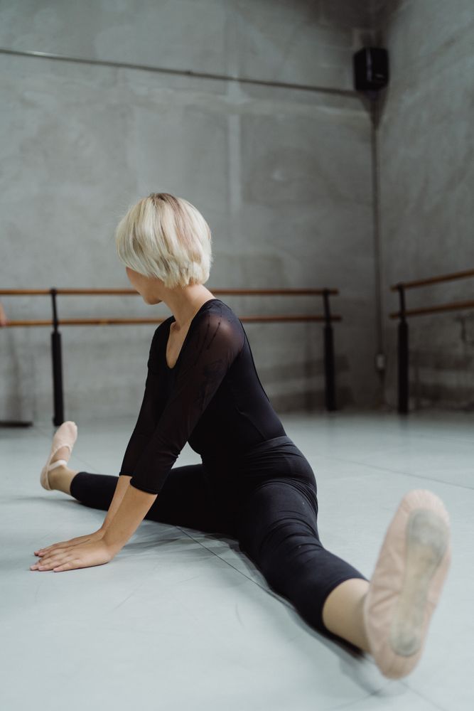 Woman practicing middle spilt