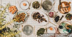 Flat-lay of Mediterranean table setting, with plant 5q361b