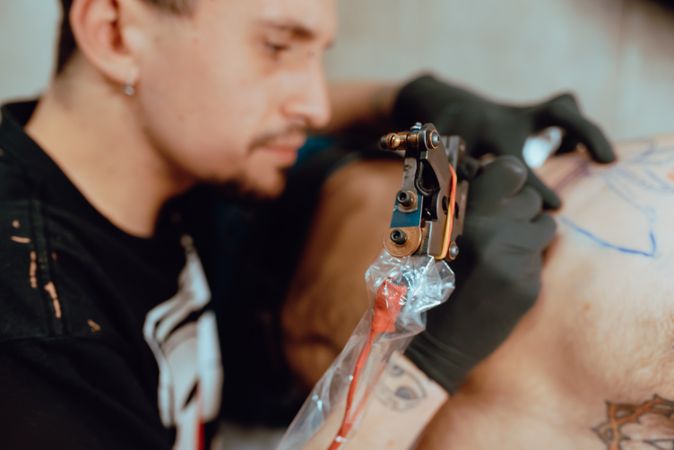 man getting tattoo