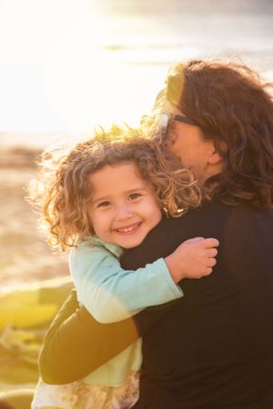 Mother and daughter enjoying sunset