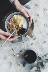 Faceless woman taking healthy breakfast bowl