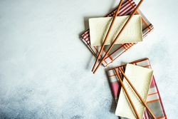Top view of chopsticks on rectangular ceramic dishes