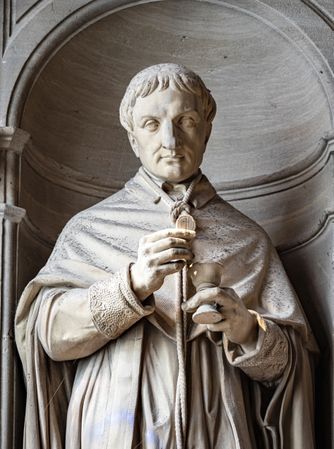Ancient sculpture in one of the churches of Paris. Antique art.