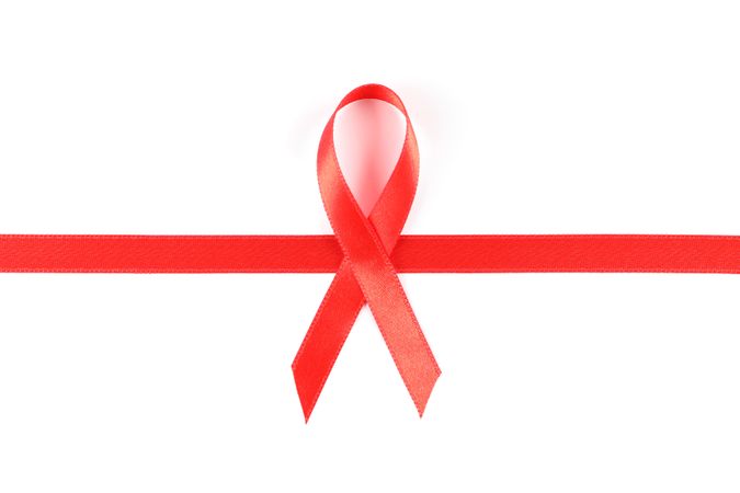 Red awareness ribbon isolated on blank background
