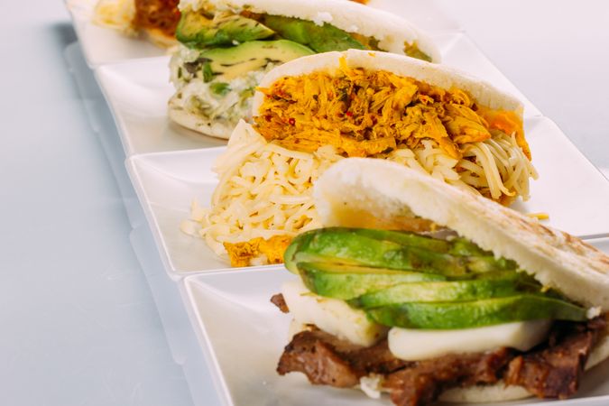 Latin American breakfast, specifically in countries such as Venezuela and Colombia, Arepas with several ingredients to fill like chicken, meat, avocado, cheese