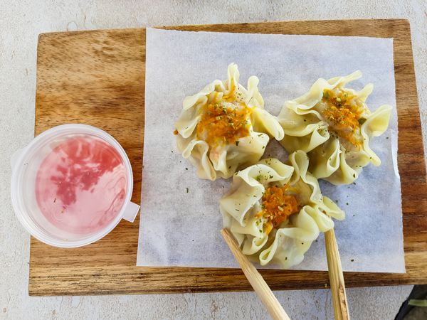 Chicken dimsum served in a wooden plate