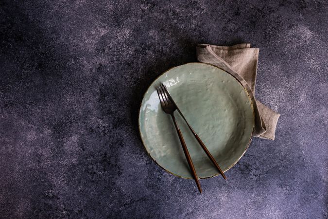Rustic table setting with light green ceramic plate