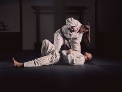 Krav Maga trainer teaching man to defend from gun