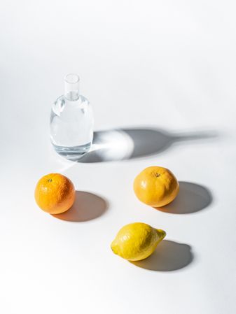 Composition of citrus and jar of water