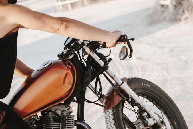 Strong man driving motorcycle