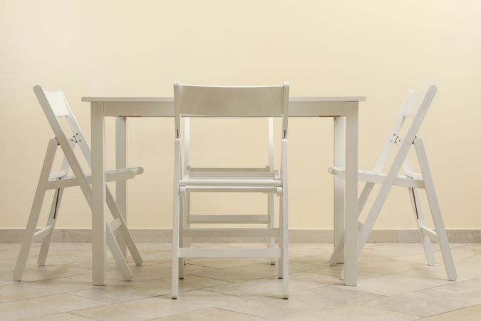 table and folding chairs in kitchen room