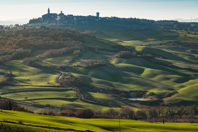 Majestic green valley with town on top