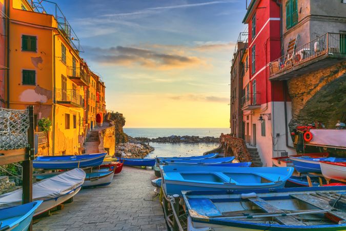 Riomaggiore village street, boats and sea, Cinque Terre, Ligury, Italy