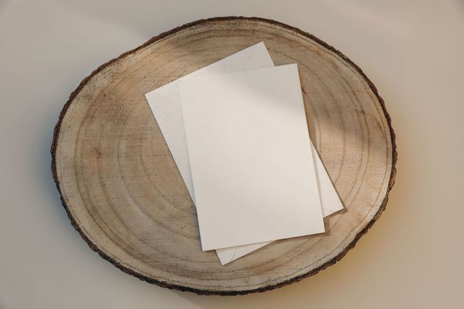 Blank paper greeting card on plate