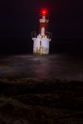 Lighthouse on rocky coastline