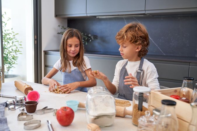 Children preparing dough for cookies