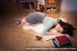 Woman sleeping surrounded by books 5rnR75