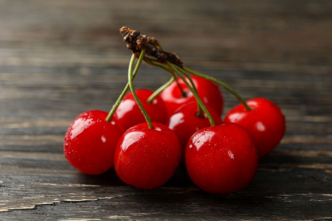 Fresh red cherry on wooden background, close up