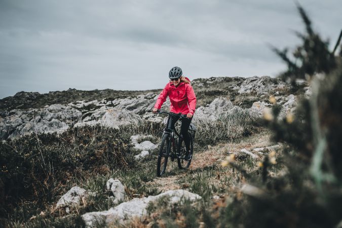 Female riding bicycle on countryside
