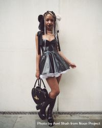London, England, United Kingdom - September 18 2021: Woman in PVC dress and heart handbag 4dyenb