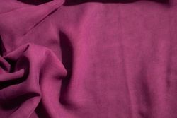 Soft purple fabric wavy crumpled background abstract with copy space