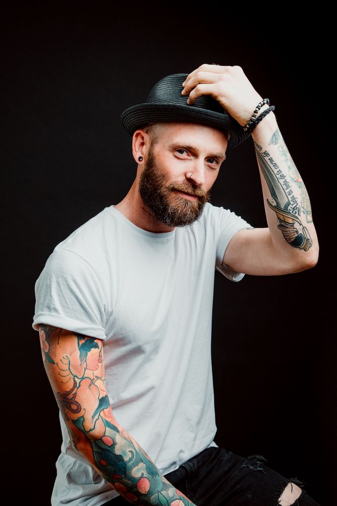 Smiling young guy in hat