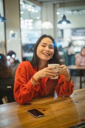 Woman having a cup of coffee