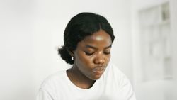 Young Black Woman with a Serious Expression on Her Face.