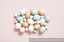 Top view of different colored eggs on pink background 4m3gv0