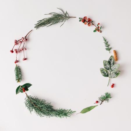 Minimalistic Christmas wreath made of winter branches and berries