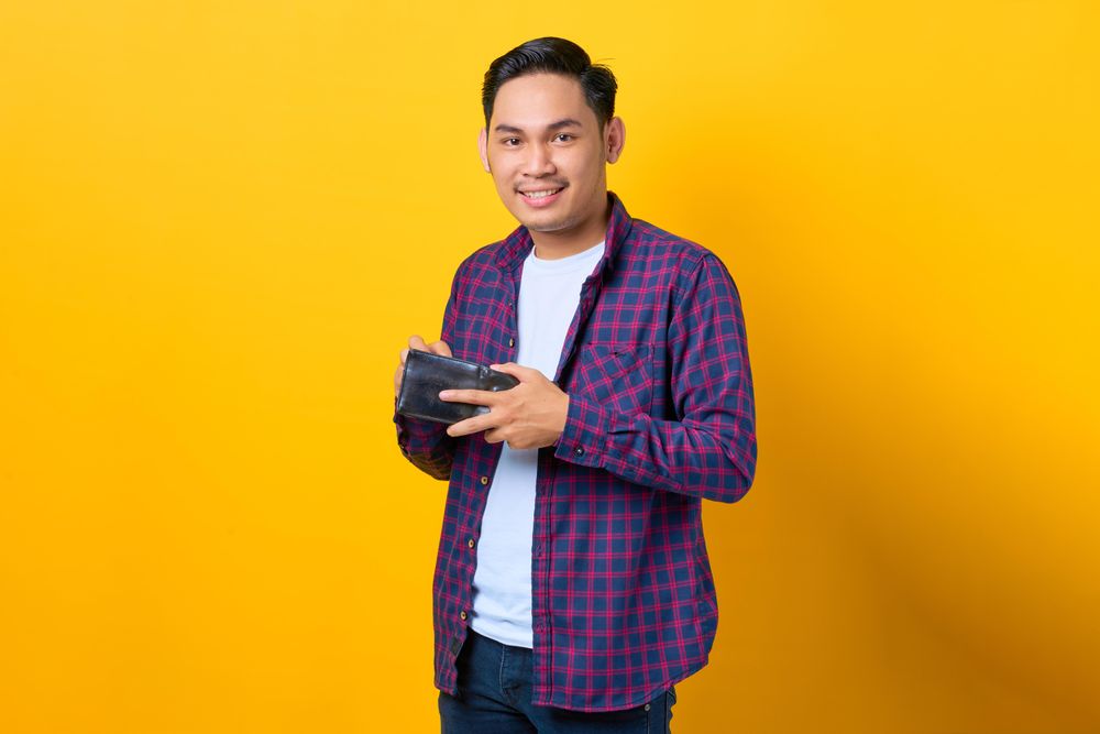 Content man opening his wallet