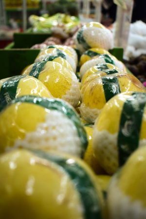 Citrus fruit pack wrapped and for sale in market store