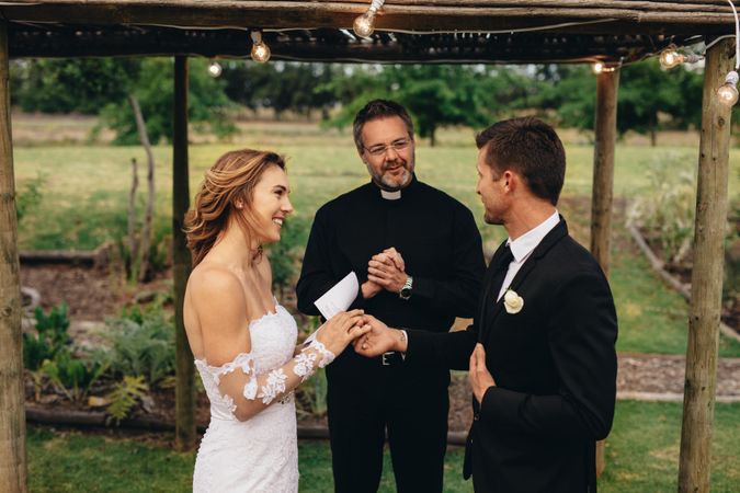 Couple reading wedding vows for each other