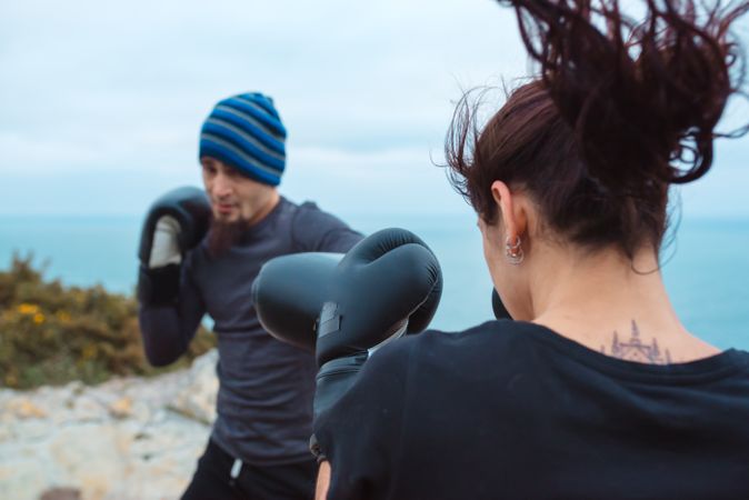 Boxers exercising on cliff