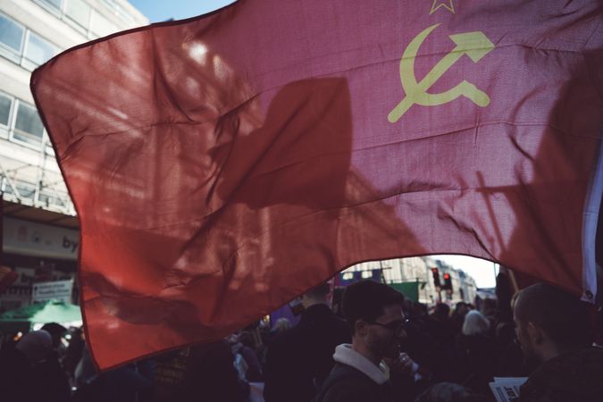 London, England, United Kingdom - March 19 2022: Communist flag flying at a protest