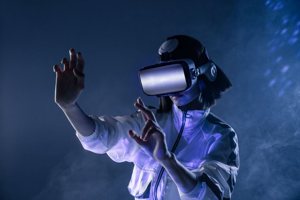 Woman touching air in VR glasses