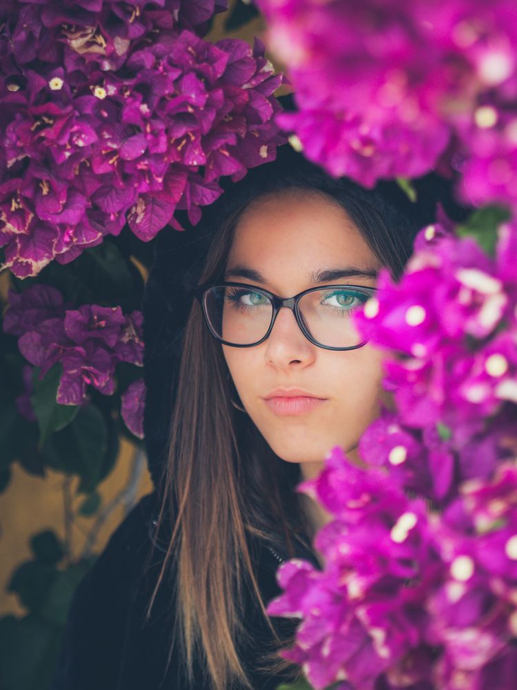 Woman on background of stunning violet flowers