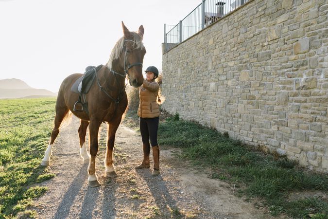 Woman on horse in field