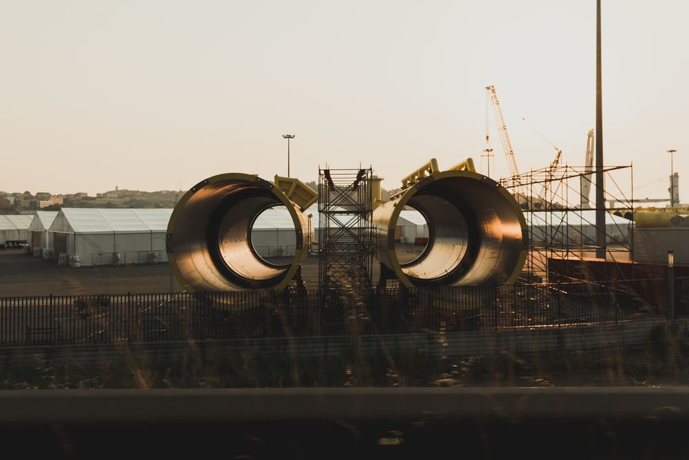 New metal pipes locating on industrial ground