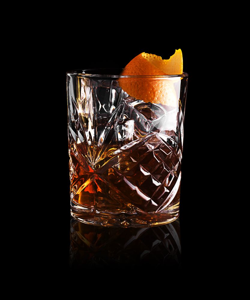 Whisky in glass with orange